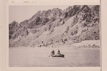 Southwest Explorations in Cataract Canyon.  William Dickinson and Jon Lindbergh operating a small inflated unit with paddles.  Near Mile 208 1/2