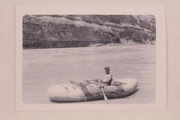 Bill Davis in his canvas-covered neoprene inflated boat.  Davis writes:  In this I carried all food and equipment and a passenger, except no passenger in Badger, and we lined Hance.  The boat is packed as shown, waiting for the passenger