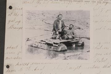 Andy Samsky and Neil Johnson on float used to bring gas from Gretchen Bar to the motorboat "Mallard" near the oil seep
