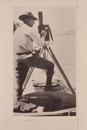 Emery Kolb with his motion picture camera on Cataract Canyon run of 1921, Sep