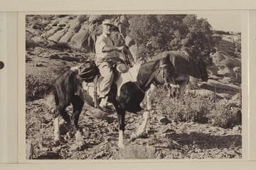 Otis Marston riding in Navajo Canyon enroute to "Arch in the Sky"