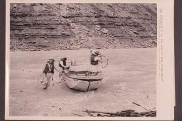 The "Esmeralda II" at the foot of Soap Creek Rapid. The bilge is being pumped and gas cached for a possible run up the Canyon. The craft is now at the Visitors Center at Grand Canyon National Park