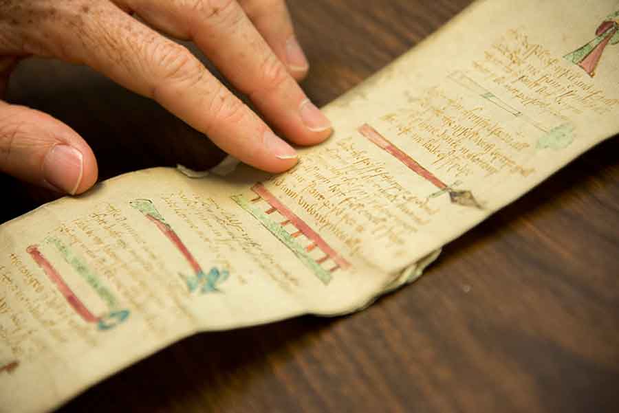 The manuscript is illustrated with objects related to the Crucifixion and its aftermath, as narrated by the gospels of the New Testament (from right to left): the lance that the soldier Longinus used to pierce Christ’s side, creating his fifth wound; the ladder needed to take Christ’s body down from the cross; and the hammer and tongs used to remove the nails from Christ’s hands and feet. Photograph by Kate Lain. The manuscript is illustrated with objects related to the Crucifixion and its aftermath, as narrated by the gospels of the New Testament (from right to left): the lance that the soldier Longinus used to pierce Christ’s side, creating his fifth wound; the ladder needed to take Christ’s body down from the cross; and the hammer and tongs used to remove the nails from Christ’s hands and feet. Photograph by Kate Lain.